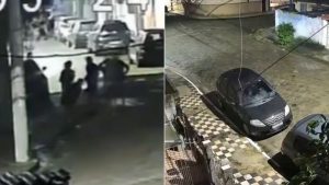 Câmera de segurança registra grupo de criminosos cercando carro de mulher durante assalto em cruzamento no bairro Vila Ponte Nova, em Cubatão.