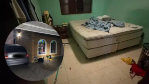 Viatura da Polícia Militar em frente a uma residência, ilustrando a operação de resgate de uma mulher e seu bebê mantidos em cárcere privado em Mogi Guaçu.
