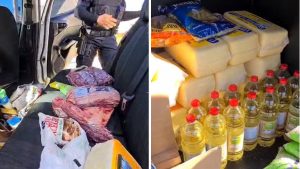 Casal preso em Indaiatuba durante perseguição: imagem mostra um carro com compartimento lotado de alimentos e bebidas apreendidos, incluindo caixas e garrafas com tampas vermelhas.