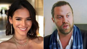 Imagem em composição com Bruna Marquezine sorrindo à esquerda e Carl Rinsch à direita, com notícia sobre Carl Rinsch condenado e prisão mencionada no contexto.