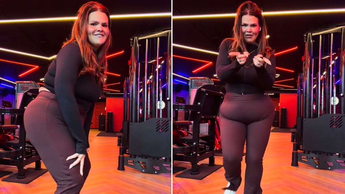 Thais Carla dança em um set de academia com luzes neon coloridas, posando confiante no palco enquanto comemora após a separação, com expressão de alegria e liberdade