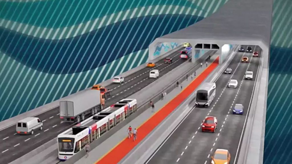 Maquete do Projeto do Túnel Santos-Guarujá, com pistas de veículos, ônibus e automóveis em um trecho submerso, destacando a via central e áreas técnicas.