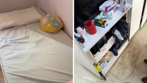 Quarto com cama e roupa de cama em condições precárias e, ao lado, móveis com roupas e objetos espalhados, ilustrando o lar de idosos interditado em Campinas por problemas de estrutura e organização.