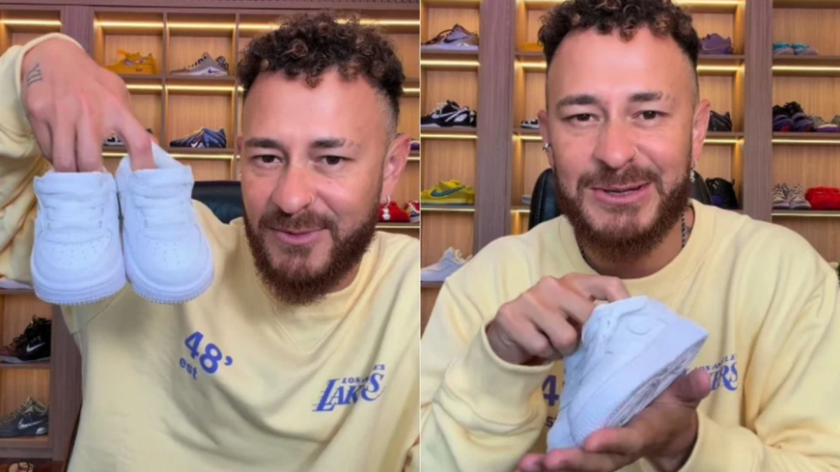 Fred Bruno em anúncio emocionante, em vídeo, mostra um par de tênis branco para a câmera e revela nova fase em sua vida, em um ambiente com prateleiras de calçados.