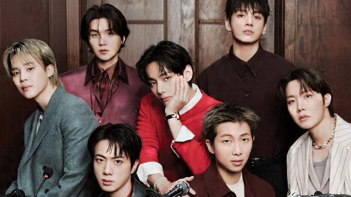 BTS em foto promocional com sete integrantes, posando juntos em cenário interno, enquanto uma matéria destaca a decisão de não inscrever o álbum ARIRANG no Grammy 2027.
