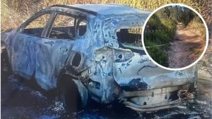 Carro queimado e destruído em uma área externa, com close em um caminho de terra ao fundo; contexto: corpo encontrado em Mogi Mirim pode ter ligação com o caso.
