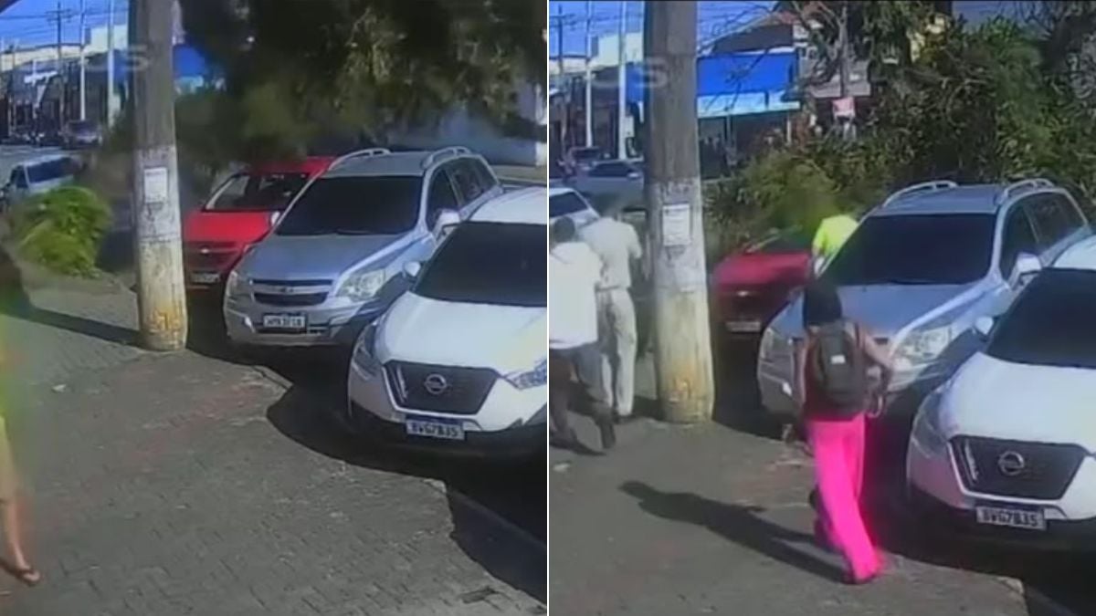Árvore cai sobre carro em Itanhaém: Árvore caiu sobre carro em Itanhaém: pai e filho são vistos em frente a veículos danificados na rua, após a queda da árvore, em imagens de vídeo