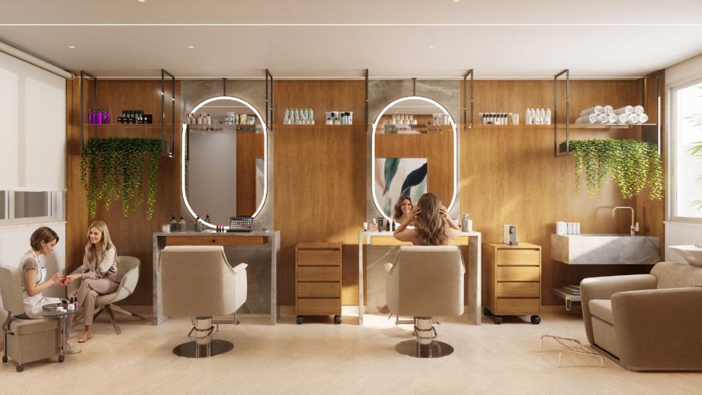 Ambiente de salão de beleza em apartamento decorado, com duas bancadas, espelhos ovais e cadeiras estofadas, no contexto do Gran Canal Residence em Santos.