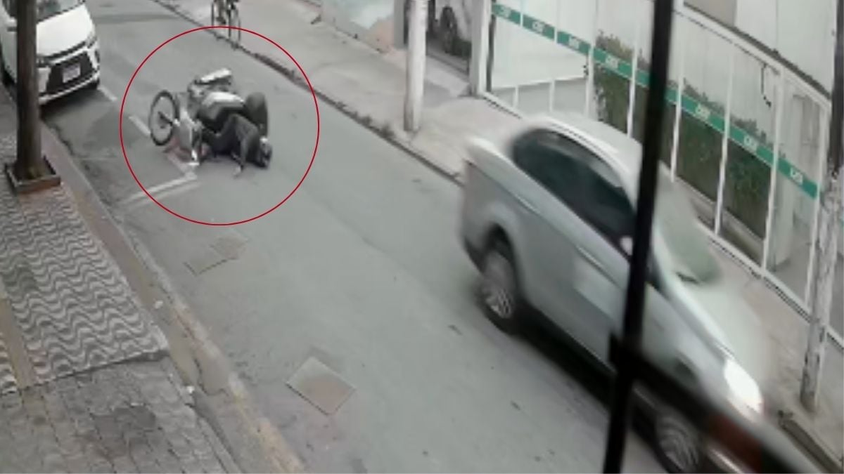 Mulher arrastada por carro em São Vicente: imagem de vídeo com homem caído e registro de socorro após colisão e arrastamento de vítima na rua
