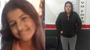 Mãe Samyra presa Peruíbe: mulher detida em foto de registro, em ambiente de delegacia, ao lado de um painel com numeração, com expressão séria.