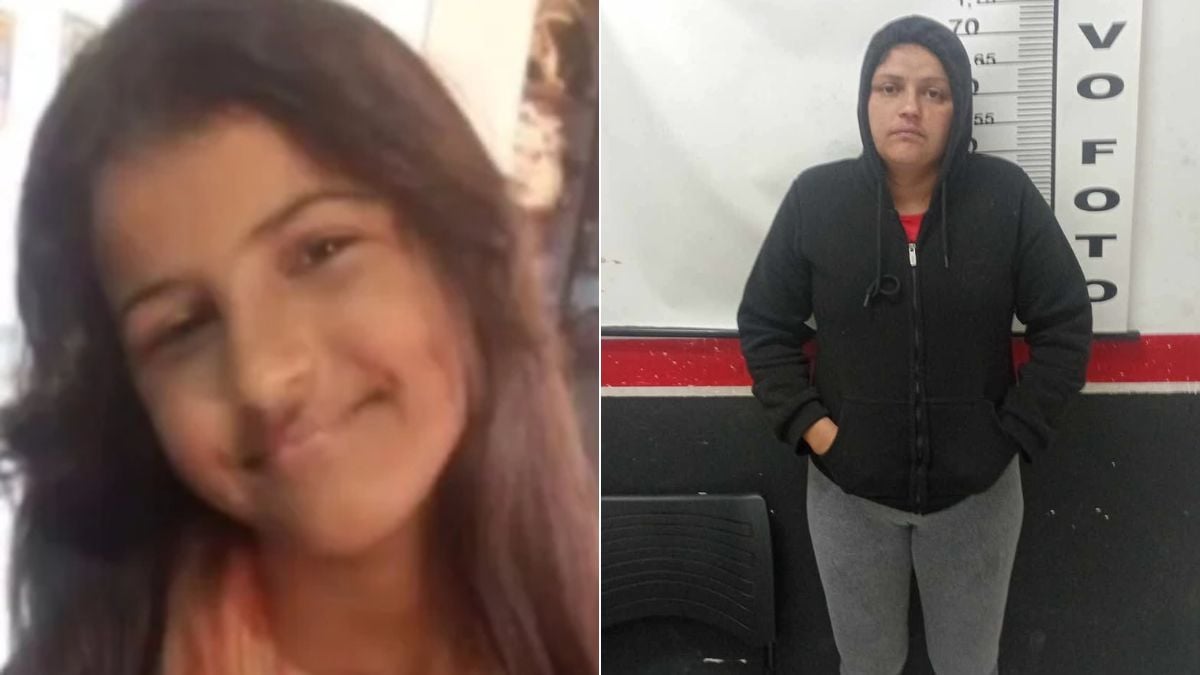 Mãe Samyra presa Peruíbe: mulher detida em foto de registro, em ambiente de delegacia, ao lado de um painel com numeração, com expressão séria.