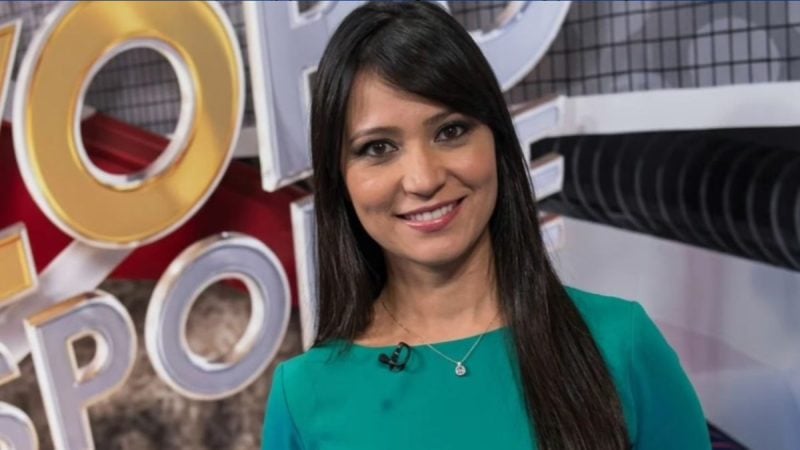Thalita Tavares sorri em estúdio de televisão, em meio a elementos gráficos de programa esportivo; apresentadora aparece em foto de destaque para notícia.