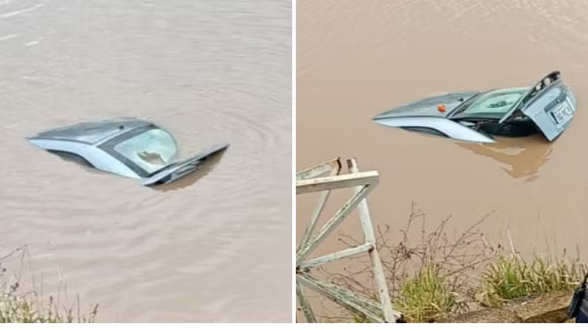 Imagens mostram um carro submerso no Lago do Taboão, com o veículo parcialmente dentro da água, após acidente em Bragança Paulista. "motorista morre após carro cair no Lago do Taboão"
