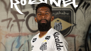 Rodinei aparece em foto de apresentação com camisa do Santos, em anúncio de contratação do lateral-direito até o final de 2027, com fundo grafitado e logotipo do clube.