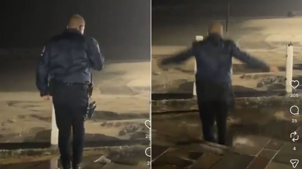 GCM cai em cratera em Praia Grande: Vídeo registra GCM em segurança ao lado de uma grande cratera aberta na orla de Praia Grande, durante chuva, com o agente sendo atingido pela abertura do chão.