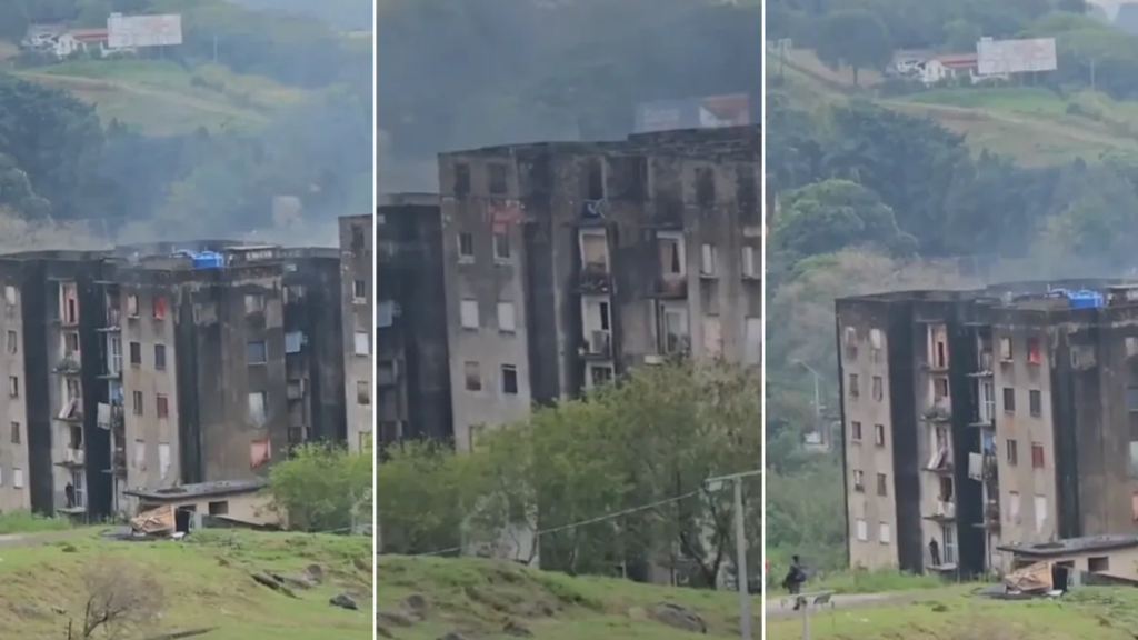 Incêndio em Campinas: vista de prédios danificados por fogo em um bairro, com fumaça e área ao redor isolada, enquanto equipes atendem o local após ocorrência no Jardim Itayu, com pessoas feridas levadas ao 10º Distrito Policial.