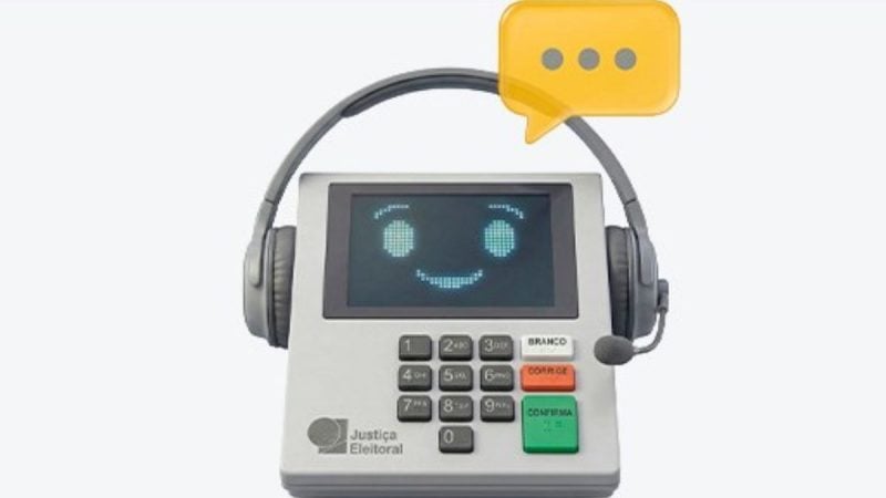 Telefone de atendimento da Justiça Eleitoral com fone de ouvido e mensagem no visor, em fundo claro, representando suporte e comunicação institucional