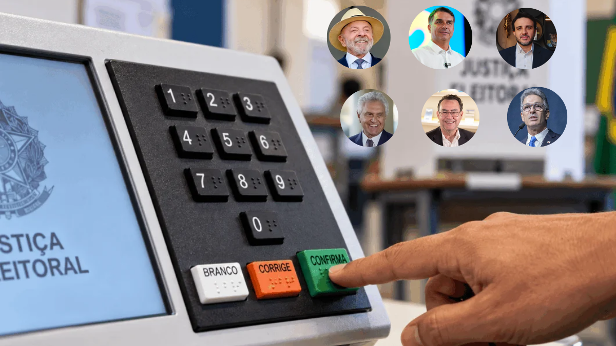 Urna eletrônica em primeiro plano com uma mão pressionando a tecla “CONFIRMA”; ao fundo, aparecem fotos circulares de seis candidatos à Presidência da República.