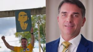 Flávio Bolsonaro aparece em campanha ao lado de imagem de Jair Bolsonaro e em foto de terno.