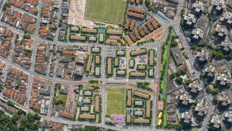 Vista aérea de bairro urbano da Vila Pantanal, bairro Saboó com ruas, quadras esportivas, áreas verdes e conjunto de casas e prédios, próximo a uma estrada e áreas de lazer.