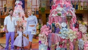 Zé Felipe, Virginia Fonseca e a filha Maria Flor vestida de Rapunzel posam ao lado de bolo temático gigante decorado com rendas cor-de-rosa e personagens.